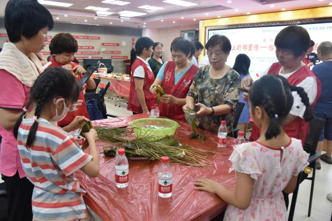 我們的節(jié)日｜“舌尖上的鄰里情”怡錦社區(qū)端午美食節(jié)活動14.png